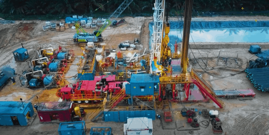 Aerial view of an industrial yard with a lot of blue containers and buildings.